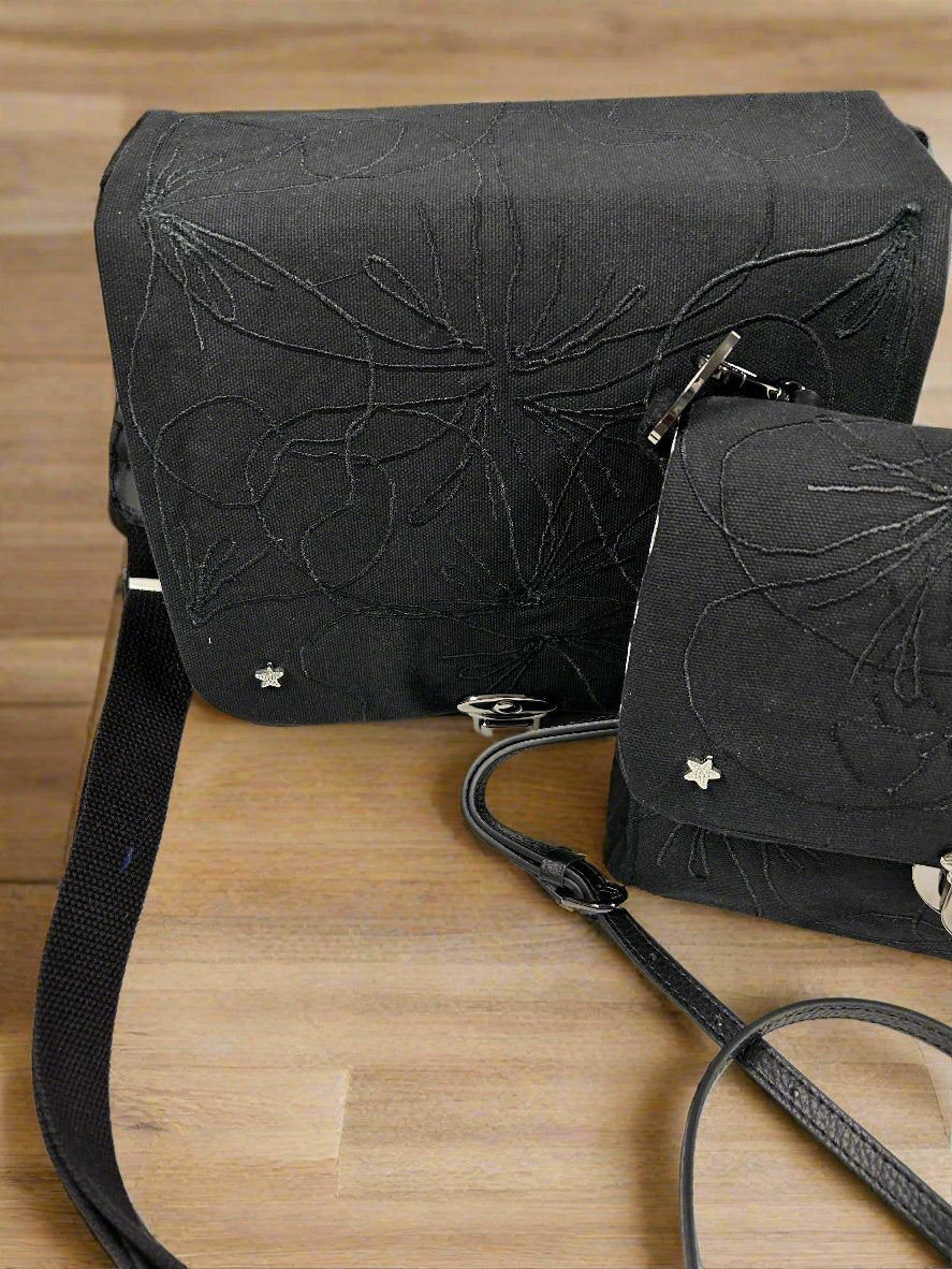 Mini embroidered canvas crossbody tote bag.